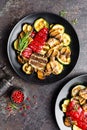 Grilled vegetable salad. Salad of barbecued zucchini, eggplant, sweet pepper, onion and mushrooms Royalty Free Stock Photo