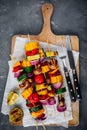 Grilled vegetable skewers with sweet corn, paprika, zucchini, onion, tomato and mushroom