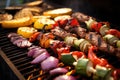 grilled vegetables alongside sizzling meat cuts on a bbq