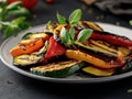 Grilled vegetables arranged on a plate, garnished with fresh herbs Royalty Free Stock Photo