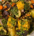 Grilled vegetables on the barbecue (corn, onion, beetroot, carrot) and chimichurri