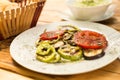 Grilled vegetables and cabbage salad, bread on a wooden table. The concept of healthy eating. Royalty Free Stock Photo