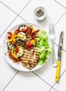 Grilled vegetables, chicken breast - delicious healthy diet lunch on a light background, top view Royalty Free Stock Photo