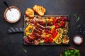 Grilled vegetables and chicken fillet. Paprika, zucchini, eggplant, mushrooms, tomatoes, onion and rosemary, served on rustic Royalty Free Stock Photo