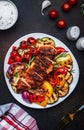 Grilled vegetables and chicken fillet salad. Paprika, zucchini, eggplant, mushrooms, tomatoes, onion and rosemary, served on plate Royalty Free Stock Photo