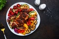 Grilled vegetables and chicken fillet salad. Paprika, zucchini, eggplant, mushrooms, tomatoes, onion and rosemary, served on plate Royalty Free Stock Photo