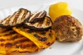 Grilled vegetables, cutlet and potatoes on a plate. Dinner for the family. A portion. Healthy diet. Concept. Blurred