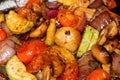 Grilled vegetables extreme close up background. Mixed sliced white mushrooms, zucchini, cherry tomatoes, purple onions. Colorful c Royalty Free Stock Photo