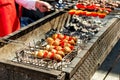 Grilled vegetables is fried on skewers on a hot coal. Tradition Royalty Free Stock Photo