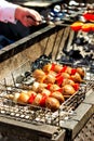 Grilled vegetables is fried on skewers on a hot coal. Tradition Royalty Free Stock Photo