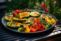 Grilled vegetables on a grill, red pepper and yellow pepper, zucchini