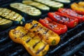 Grilled vegetables on a grill, red pepper and yellow pepper, zucchini