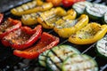 Grilled vegetables on a grill, red pepper and yellow pepper, zucchini Royalty Free Stock Photo