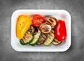 Grilled vegetables. Healthy diet. Takeaway food. Eco packaging. Top view, on a gray background