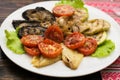 Grilled vegetables. Lettuce leaves, eggplants, pepper, tomatoes Royalty Free Stock Photo