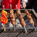 Grilled vegetables and meat is fried on skewers on a hot coal. Royalty Free Stock Photo