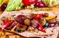 Grilled vegetables: pepper, tomatoes, onion, potatoes, mushrooms, zucchini on wooden board Royalty Free Stock Photo