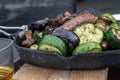 Grilled vegetables and sausages and whiskey