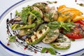 Grilled vegetables - tomatoes, zucchini, eggplant, sweet pepper, mushrooms. In a white plate Royalty Free Stock Photo