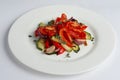 Grilled vegetables on white plate cutted on slices