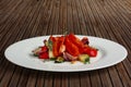 Grilled vegetables on white plate cutted on slices