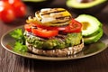 grilled veggie burger topped with fresh avocado