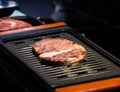 Grilled wagyu beef, Raw marble beef steak frying in black grill Royalty Free Stock Photo