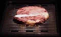 Grilled wagyu beef, Raw marble beef steak frying in black grill Royalty Free Stock Photo