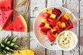 Grilled summer watermelon and pineapple fruit kabobs with feta, top view over white wood Royalty Free Stock Photo