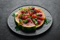 Grilled watermelon with raspberries and parsley on a black plate. Top view. Royalty Free Stock Photo