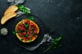 Grilled watermelon with raspberries and parsley on a black plate. Top view. Royalty Free Stock Photo