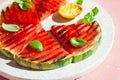 Grilled watermelon slices with lemon and basil. summer dessert