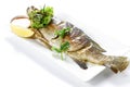 Grilled Whole Barramundi Fish Pra-Kra-Pong With Red Chili Garlic Seafood Sauce And A Piece Of Lemon On White Porcelain Plate,