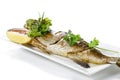 Grilled Whole Barramundi Fish With Red Chili Garlic Seafood Sauce And A Piece Of Lemon On White Porcelain Plate, Isolated On White