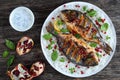 Grilled whole fish on bed of rice