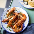 Grilled whole pink prawns seasoned with herbs