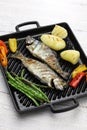 Grilled whole rainbow trout with vegetables