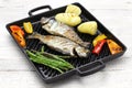 Grilled whole rainbow trout with vegetables