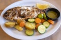 Grilled Whole Red Snapper Served with Fresh Vegetables