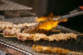 Grilled yakitori chicken skewers at an Izakaya restaurant in Omoide Yokocho street in the Shinjuku district of Tokyo.