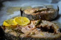 Grilled yellowtail amberjack with lemon slices. Royalty Free Stock Photo