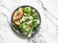 Grilled zucchini, mozzarella, cilantro salad with olive oil, lemon, garlic, pepper sauce on a light background, top view Royalty Free Stock Photo