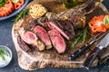 Barbecue Tomahawk Steak on grill roast with herb prepared for grill