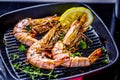 Grillen tiger prawns in iron man with lemon