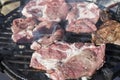 Raw pork chops. Grilling bacon . Smoke. Close up view