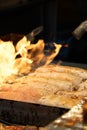 Grilling barbecue meatloaf rolled with vegetables at traditional night market in South Korea Royalty Free Stock Photo