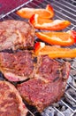 Grilling beef steaks Royalty Free Stock Photo