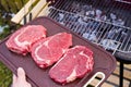 Grilling beef steaks Royalty Free Stock Photo