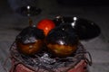 Grilling of Brinjal and tomato on coal stove or charcoal stove or mitti ka chulha or charcoal chulha or coal chulha or charcoal