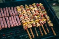 Grilling chicken meat skewers and kebab with vegetables on barbecue charcoal grill Royalty Free Stock Photo